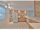 Kitchen with light wood cabinets, white appliances, and tile floor at 131 Pinehurst Dr # 131, Bradenton, FL 34210