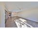 Sunlit living room with hardwood floors and access to patio at 131 Pinehurst Dr # 131, Bradenton, FL 34210