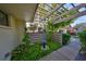 Relaxing patio area with pergola, landscaping, and bird bath at 131 Pinehurst Dr # 131, Bradenton, FL 34210