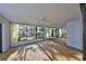 Spacious sunroom with garden views and ceiling fan at 131 Pinehurst Dr # 131, Bradenton, FL 34210