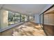 Sunroom with wall of windows, showcasing the backyard at 131 Pinehurst Dr # 131, Bradenton, FL 34210