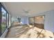 Bright sunroom with window walls, ceiling fan, and views of garden at 131 Pinehurst Dr # 131, Bradenton, FL 34210