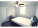 Bedroom with a bed, nightstand and double door closet at 1317 E Osborne Ave, Tampa, FL 33603