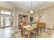 Bright dining room with wooden table and chairs, features decorative accents at 136 River Enclave Ct, Bradenton, FL 34212