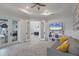 Gathering room with French doors opening to the backyard and kitchen at 16007 Castle Park Ter, Lakewood Ranch, FL 34202