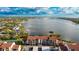 Aerial view of waterfront condo building with tennis courts and water access at 1608 Stickney Point Rd # 1608-102, Sarasota, FL 34231