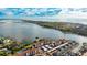 Aerial view of waterfront community with boat traffic at 1608 Stickney Point Rd # 1608-102, Sarasota, FL 34231