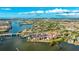 Aerial view of waterfront community with resort-style amenities and beautiful landscaping at 1608 Stickney Point Rd # 1608-102, Sarasota, FL 34231
