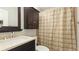 Bathroom with vanity, shower, and patterned curtain at 1608 Stickney Point Rd # 1608-102, Sarasota, FL 34231