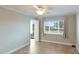 Bright bedroom with tile floors, ceiling fan, and water view at 1608 Stickney Point Rd # 1608-102, Sarasota, FL 34231