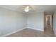 Spacious bedroom with tile floors and ceiling fan at 1608 Stickney Point Rd # 1608-102, Sarasota, FL 34231