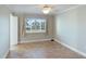 Bright bedroom with tiled floors and a window with water view at 1608 Stickney Point Rd # 1608-102, Sarasota, FL 34231