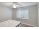 Bedroom with tiled floors, ceiling fan, and window blinds at 1608 Stickney Point Rd # 1608-102, Sarasota, FL 34231