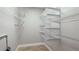 Well-organized closet with wire shelving and hanging rods at 1608 Stickney Point Rd # 1608-102, Sarasota, FL 34231