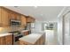 Kitchen with stainless steel appliances and water views at 1608 Stickney Point Rd # 1608-102, Sarasota, FL 34231
