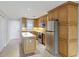 Modern kitchen with stainless steel appliances and an island at 1608 Stickney Point Rd # 1608-102, Sarasota, FL 34231