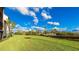 Landscaped lawn area with water views at 1608 Stickney Point Rd # 1608-102, Sarasota, FL 34231