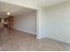 Open concept living room with kitchen and tile flooring at 1608 Stickney Point Rd # 1608-102, Sarasota, FL 34231