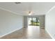 Bright living room with tile floors and sliding doors to patio at 1608 Stickney Point Rd # 1608-102, Sarasota, FL 34231