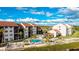 Community pool and condo building with waterfront views at 1608 Stickney Point Rd # 1608-102, Sarasota, FL 34231