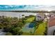 Waterfront tennis court with surrounding landscape at 1608 Stickney Point Rd # 1608-102, Sarasota, FL 34231