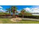 Wooden waterfront path with surrounding vegetation at 1608 Stickney Point Rd # 1608-102, Sarasota, FL 34231