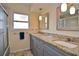 Double vanity bathroom with granite countertops at 1864 Mid Ocean Cir, Sarasota, FL 34239