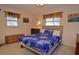 Cozy bedroom with a blue floral comforter and built-in storage at 1864 Mid Ocean Cir, Sarasota, FL 34239