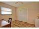 Bedroom with a desk and built-in closet at 1864 Mid Ocean Cir, Sarasota, FL 34239
