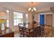 Dining room with hardwood floors and view to front yard at 1864 Mid Ocean Cir, Sarasota, FL 34239