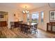 Bright dining room with large bay window and hardwood floors at 1864 Mid Ocean Cir, Sarasota, FL 34239