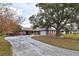 Brick home with a circular driveway at 1864 Mid Ocean Cir, Sarasota, FL 34239