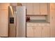 Stainless steel refrigerator and ample kitchen cabinets at 1864 Mid Ocean Cir, Sarasota, FL 34239