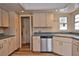 Kitchen with stainless steel appliances and light wood cabinets at 1864 Mid Ocean Cir, Sarasota, FL 34239