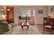 Spacious living room with hardwood floors, bay window, and comfortable seating at 1864 Mid Ocean Cir, Sarasota, FL 34239