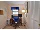 Home office with built-in shelving and a comfortable chair at 1864 Mid Ocean Cir, Sarasota, FL 34239