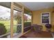 Relaxing patio with table, chairs, and grill at 1864 Mid Ocean Cir, Sarasota, FL 34239