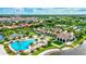 Aerial view of community with resort-style pool and clubhouse at 215 Toscavilla Blvd, Nokomis, FL 34275