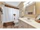 Clean bathroom with a white vanity and shower/tub combo at 2154 Lakewood Dr, Nokomis, FL 34275