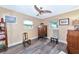 Charming bedroom with rocking chair and hardwood floors at 2154 Lakewood Dr, Nokomis, FL 34275