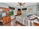 Bright bedroom with built-in shelving and wood flooring at 2154 Lakewood Dr, Nokomis, FL 34275