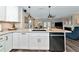 Modern kitchen with white cabinets and quartz countertops at 2154 Lakewood Dr, Nokomis, FL 34275