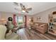 Living room with hardwood floors, comfortable seating and large windows at 2154 Lakewood Dr, Nokomis, FL 34275