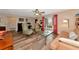 Living room with hardwood floors, large windows and comfortable seating at 2154 Lakewood Dr, Nokomis, FL 34275
