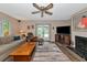 Relaxing living room with a view to the patio and fireplace at 2154 Lakewood Dr, Nokomis, FL 34275