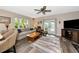Spacious living room with access to the patio and fireplace at 2154 Lakewood Dr, Nokomis, FL 34275