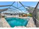 Large swimming pool with a screened enclosure at 2154 Lakewood Dr, Nokomis, FL 34275