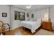 Comfortable bedroom features a large window for natural light and white decor at 2218 Shadow Oaks Rd, Sarasota, FL 34240