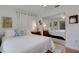 Well-lit bedroom with mirrored closet and hardwood floors at 2218 Shadow Oaks Rd, Sarasota, FL 34240