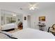 Bright bedroom with a queen-size bed and mirrored closet at 2218 Shadow Oaks Rd, Sarasota, FL 34240